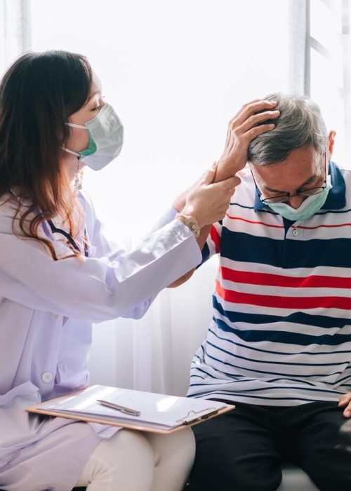 asian-doctor-visit-examines-senior-man-home-with-headage-pain-doctor-checking-up-consulting-retirement-health-hospital-services-wearing-mask-protect-covid19_640221-108